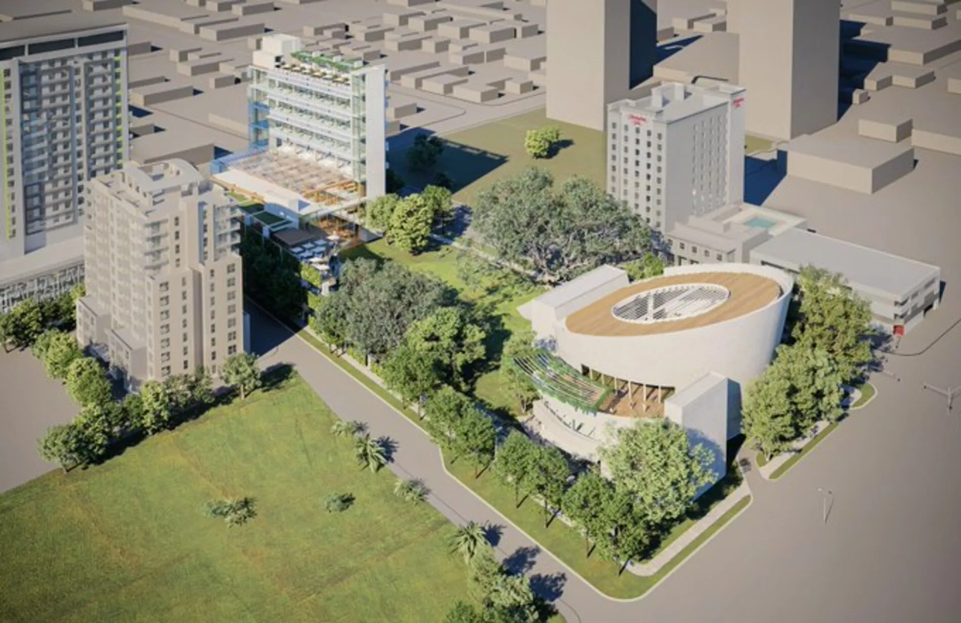 Architectural rendering of the proposed Fort Lauderdale Arts Park in Flagler Village, showcasing a modern concert venue, green space, and mixed-use development.